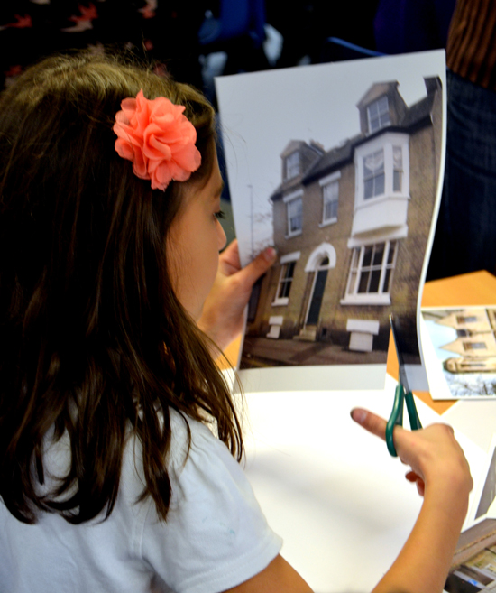 Pupil cuts an image of a local building to collage