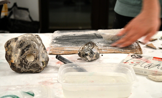 Students build their drawings with layers of modroc and graphite to echo the very forming of the rocks