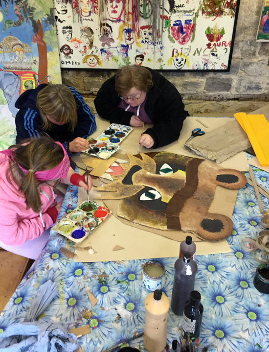 Students working together on props
