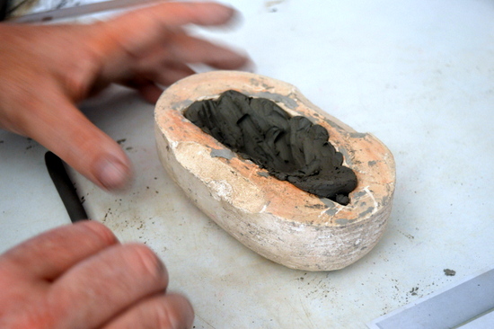 Initially Mark pressed clay into the mould