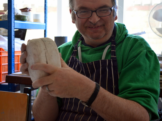 Mark squeezes the two halves of the mould together