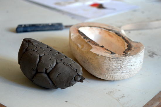 Open mould with whole clay form, ready to be smoothed and made into a bird