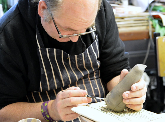 Mark paints his penguin