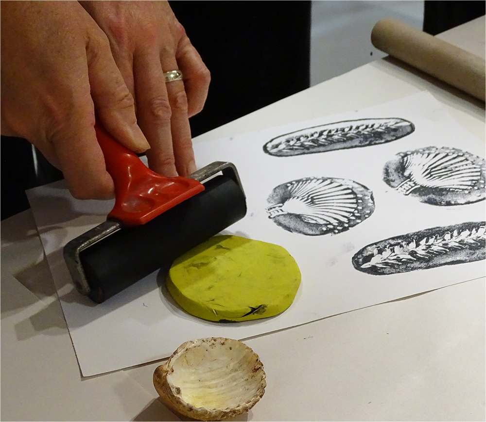 Place the Plastacine down onto the Paper and use a Roller to apply Pressure
