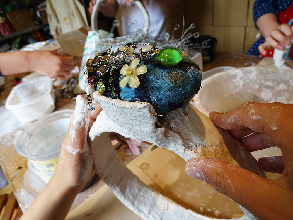 We put modroc over the cardboard to hold the gemstone in place