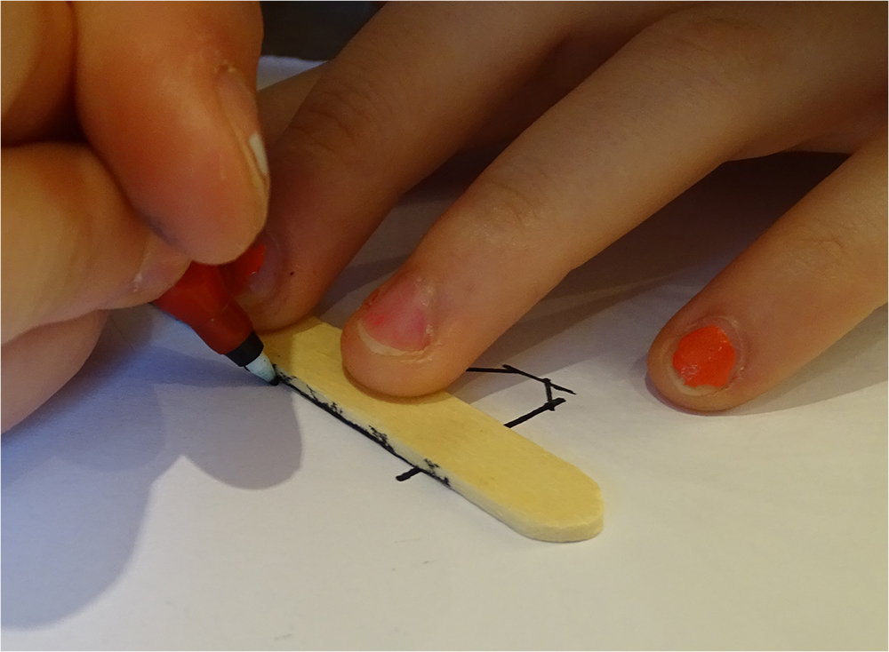 Using a lolly stick as a ruler