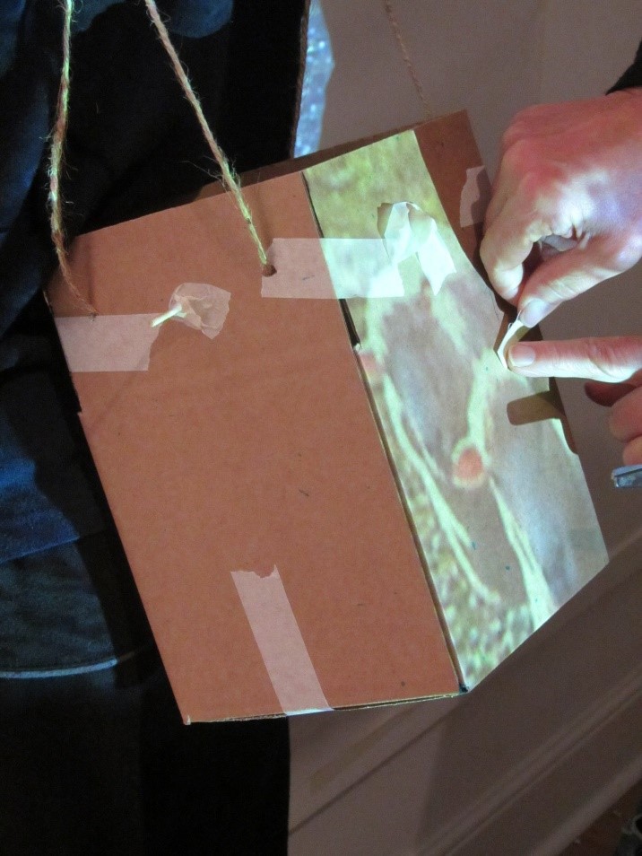 Using projected video imagery as a guide for applying the glow in the dark tape