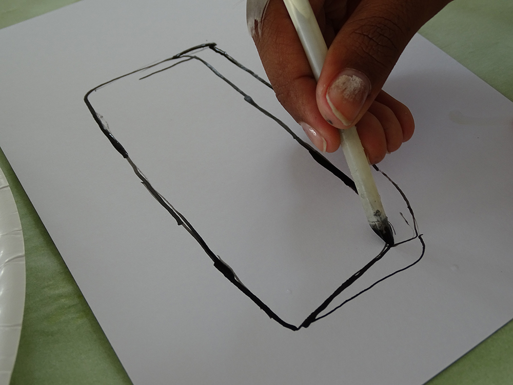 Using ink and quill to draw a paint palette