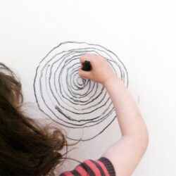 Explore drawing using whole body movements