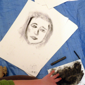 Using fingers and hands to paint portraits