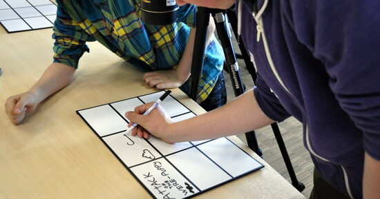 Students work on a story board for Drawings which Move Students work on a story board for Drawings which Move