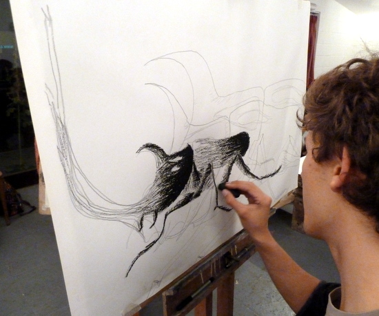 Drawing insects big: Adam drawing  a Rhinoserous Beetle on loan from Cambridge University Museum Of Zoology