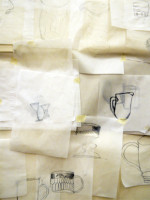 All the drawings taped to the wall to make one large still life