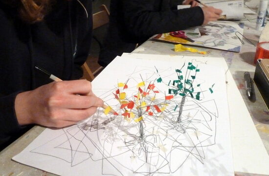 Mixed media: Student working - Drawing feeding making - tree growing from the paper - on the wall