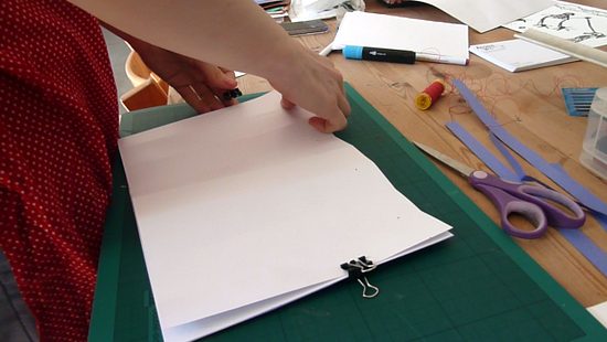 Align paper and then secure with a bull dog clip