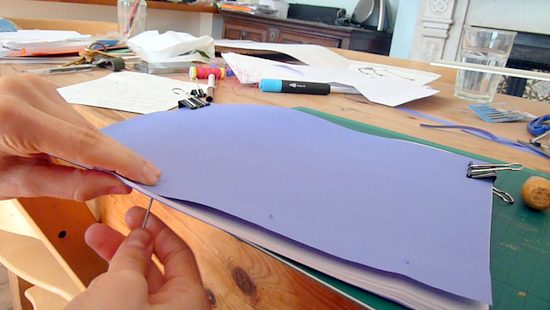 Sewing all the pages together all the way up through the second hole