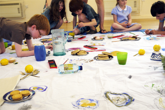 Creating a shared drawing of a picnic rug. Draw the food then eat it!