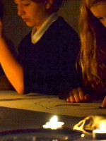 Students draw skulls, on loan from University of Cambridge Museum of Zoology, Cambridge, in candle light
