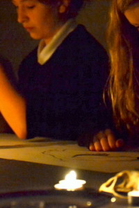 Students draw skulls, on loan from University of Cambridge Museum of Zoology, Cambridge, in candle light