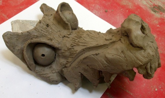 Demon dog head made in clay slab by a year five student at The Belfry Primary School, Overstrand