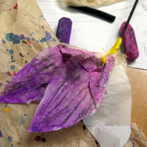 Student creates texture and colour by mark making onto a sculptural flower