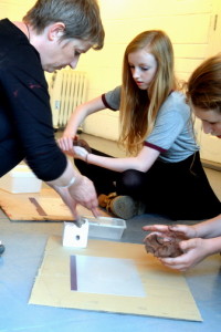 Rachel Wooller demonstrates to teenagers