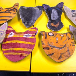 Making animal heads from newspaper