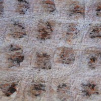 Cutting into the surface and stitching over layers
