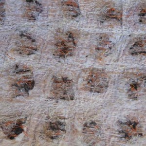 Cutting into the surface and stitching over layers