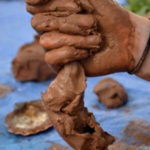 An activity offering the chance to explore and PLAY with clay -  encouraging tactile investigation of the matter, with no end result intended or prescribed.