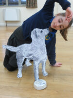 "Flat yet sculptural" standing dog!