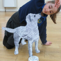 "Flat yet sculptural" standing dog!