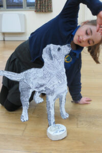 "Flat yet sculptural" standing dog!