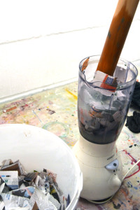 Make sure that the the blender is unplugged and use a rolling pin to push the paper down into the water 1