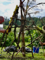 Adding moss and clay to the structure by Mostyn de Beer