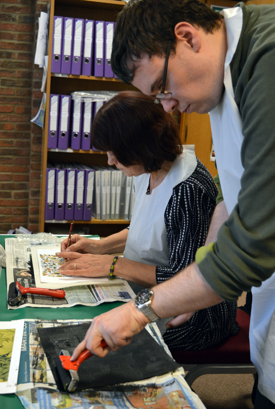 Student at Red2Green preparing a 'plate' for monoprinting