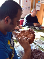 Student examines his work and looks at the detail captured by the clay