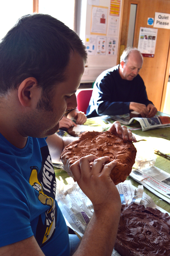 Exploring mark making into wet clay, mould making, mixing and pouring plaster