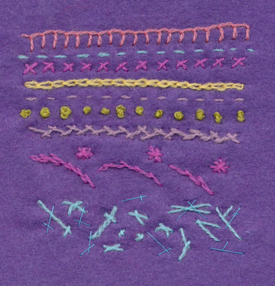 Stitching onto felt. Stitches include: blanket stitch, cross stitch, chain stitch, French knots, herringbone stitch and satin stitch and also experiementing with cross stitch to make different marks