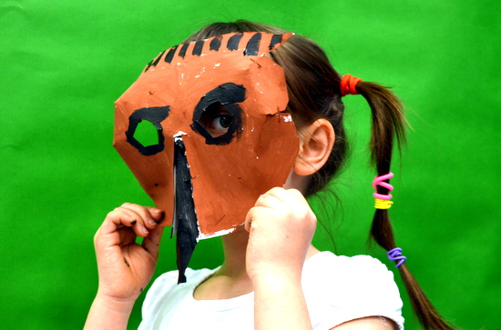 Pupils put finishing touches on their animal masks using paint