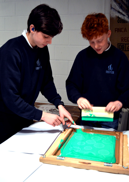 Boys get to work! Andy encourages experimenation and working by trial and error to explore screen printing
