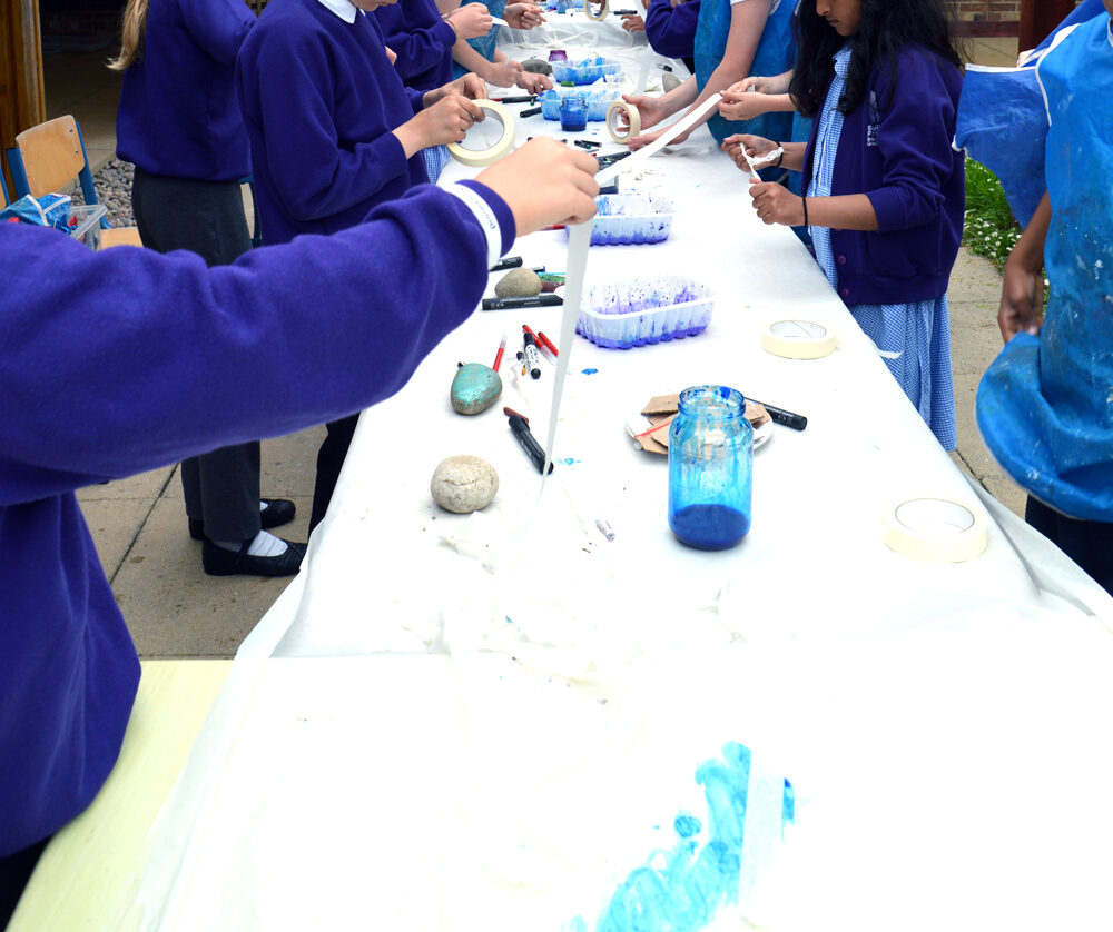 Initially pupils draw long river lines in masking tape 