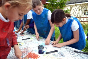 Children make marks in oil pastel