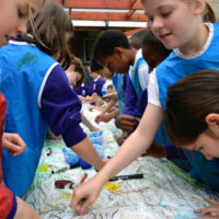 Pupils building up the drawing with oil pastels