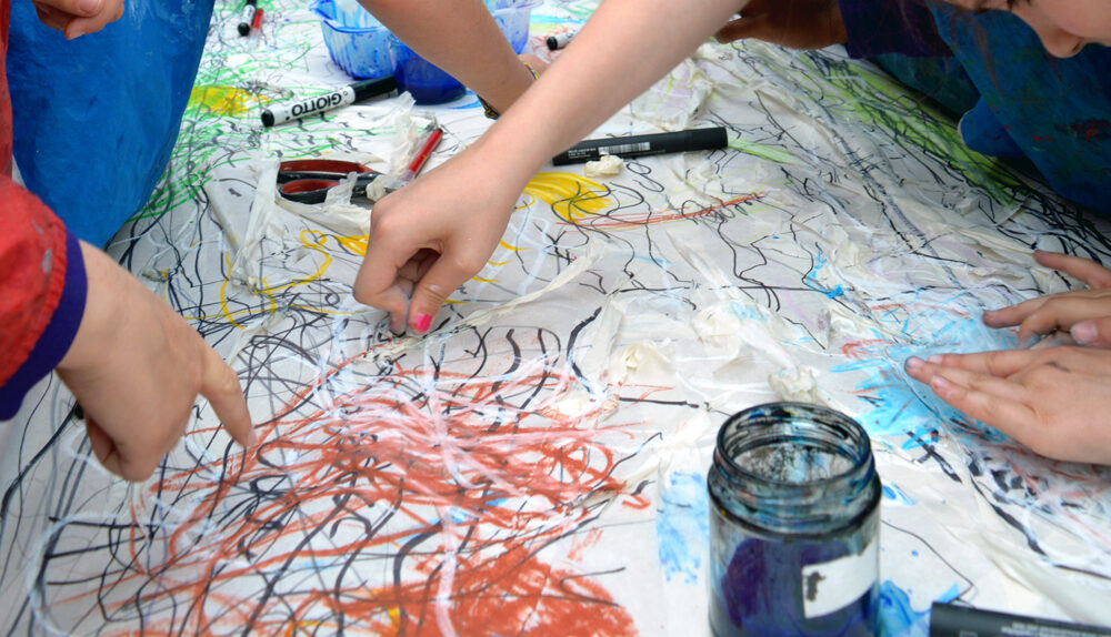 Pupils building up the drawing with oil pastels