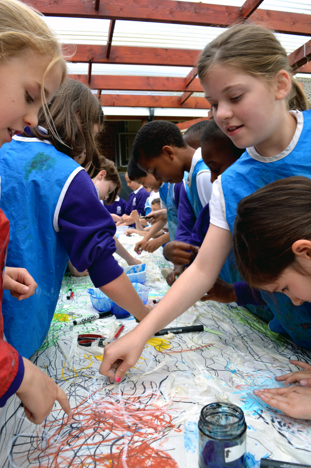 Pupils building up the drawing with oil pastels