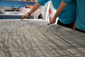 Teenagers were introduced to graphite, charcoal, masking tape and acrylic paint as mediums for communal expressive mark making. A collective drawing was produced, whereby students were encouraged to work in collaboration and in response to each other.