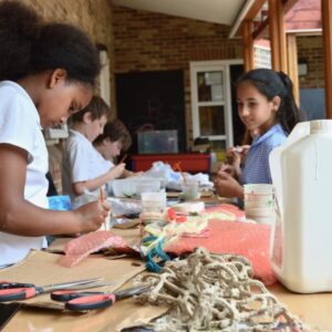 Children start work building reliefs inspired by the 'under the ocean' theme, with a variety of waste materials - SC Ridgefield