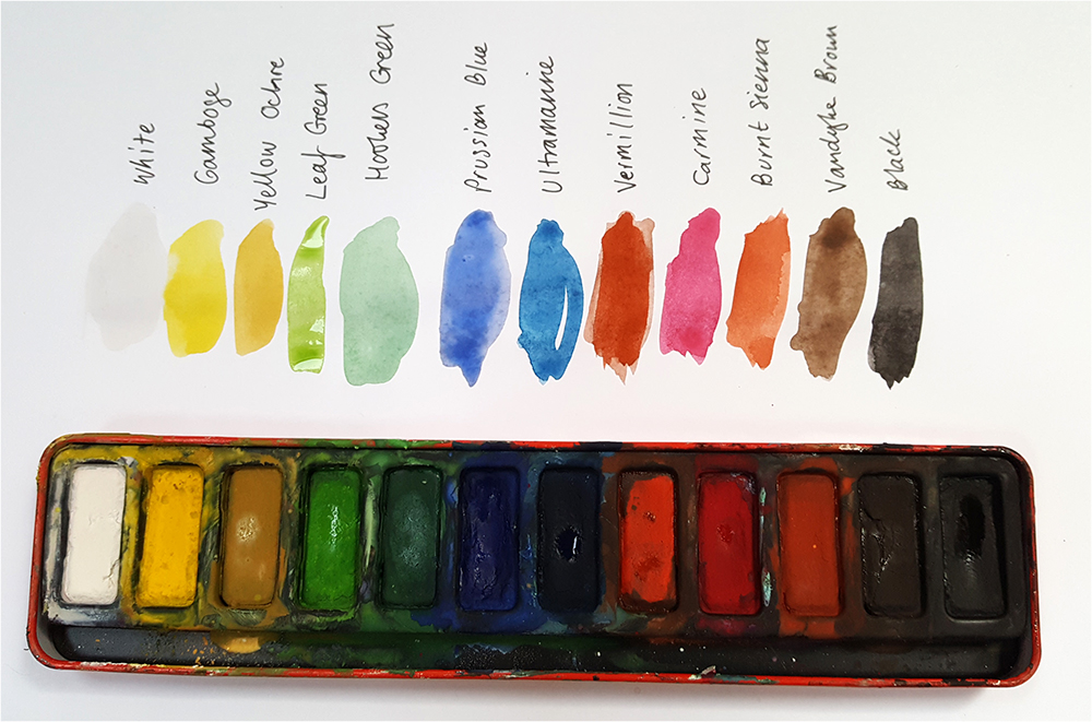 Range of colours in a school watercolour palette