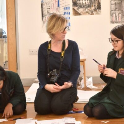Lisa walker working with a student from Frances Bardsley Academy during a workshop inspired by the AccessArt Village exhibtion
